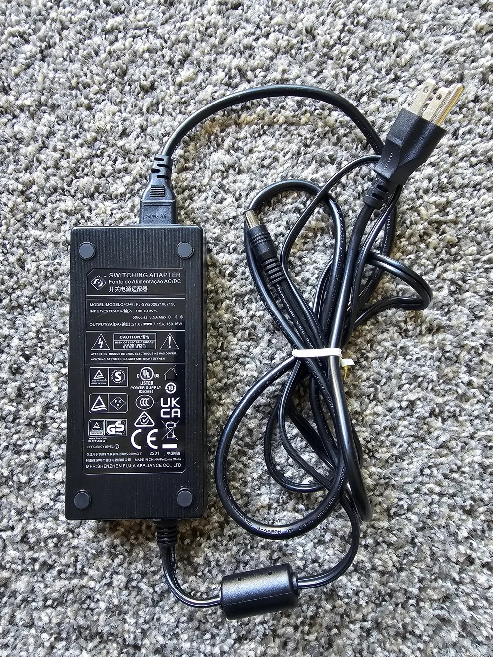 Shenzhen FJ-SW202821007150 switching power adapter.  Input: 100-240V~ 50/60Hz 3